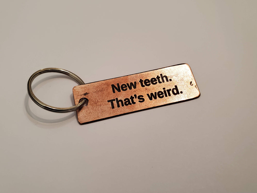New teeth. That's weird. - Key Chain