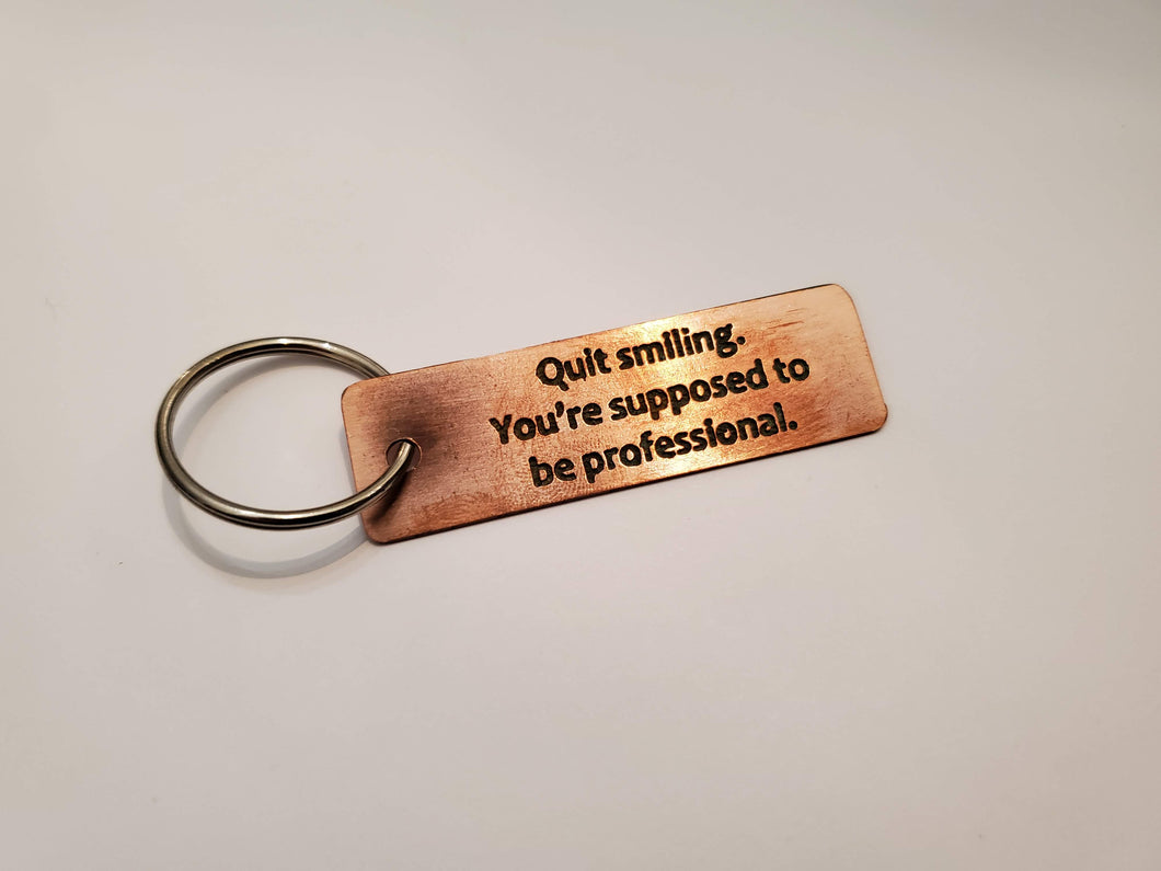 Quit smiling. You're supposed to be professional. - Key Chain