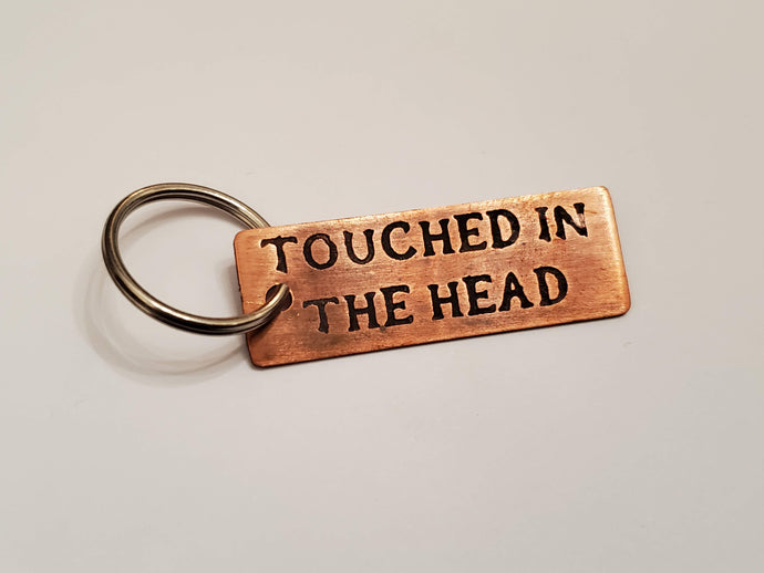 Touched in the head - Key Chain
